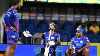 Mumbai Indians' captain Hardik Pandya, centre, with head coach Mahela Jayawardene, right, and batting coach Kieron Pollard during a training session ahead of an Indian Premier League (IPL) 2026 T20 cricket match between Chennai Super Kings and Mumbai Indians, in Chennai, Tamil Nadu. Captaincy, coaching, trade talk to headline Mumbai Indians' season review next week