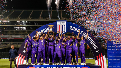 LAKR team with the MLC trophy (X) Shah Rukh Khan celebrates LA Knight Riders' maiden MLC title after thrilling final win