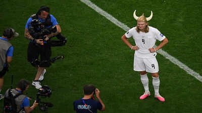 Norway's Erling Haaland (9) poses after the World Cup round of 32 (AP Photo) Erling Haaland scores, then dons cowboy gear before unleashing his inner Viking
