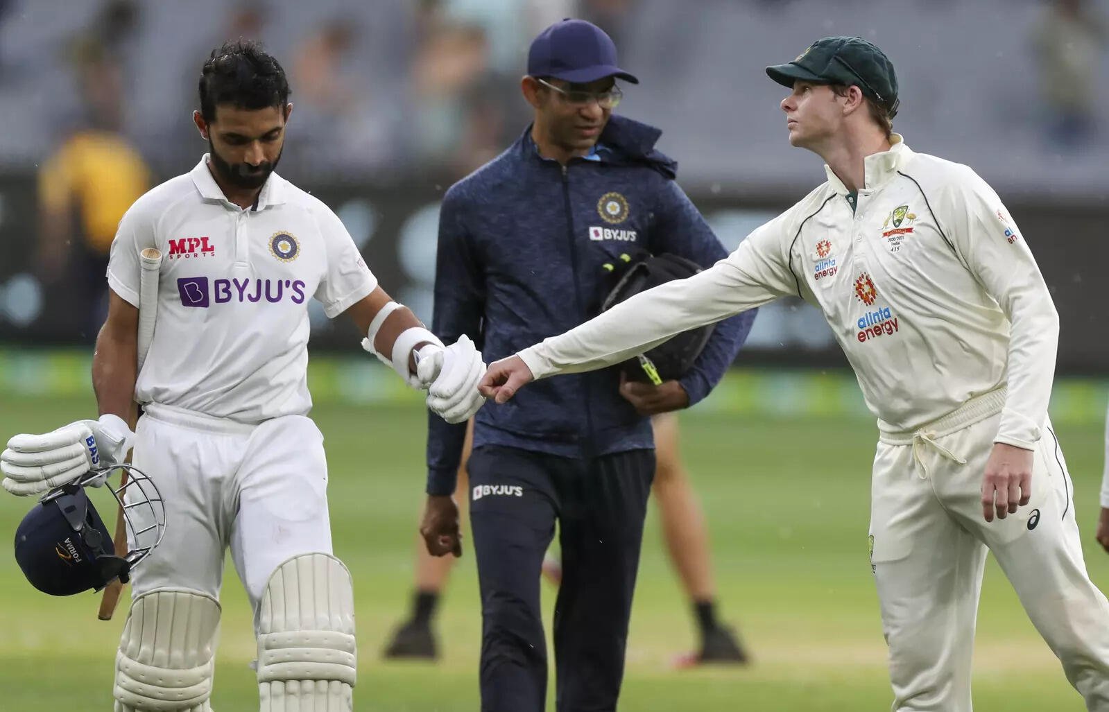 Melbourne : India's Ajinkya Rahane, left, is congratulated by Australia's Steve ...