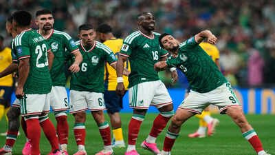 Mexico's Raul Jimenez, right, celebrates after scoring his side's second goal. (AP Photo) Mexico vs Ecuador, FIFA World Cup Match Report: El Tri end 40-year knockout curse, beat Ecuador 2-0 to reach last 16