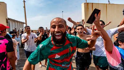 Migrants cross from Morocco into the Spanish enclave of Ceuta, Thursday, July 30, 2026. (AP Photo/Antonio Sempere) 'Declare national emergency': Videos of Moroccan migrants entering Spain after swimming around border barriers go viral