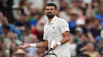 Novak Djokovic of Serbia reacts during his match against Felix Auger-Aliassime of Canada. (AP Photo) Novak Djokovic survives longest Wimbledon quarter-final ever, sets up blockbuster Jannik Sinner showdown