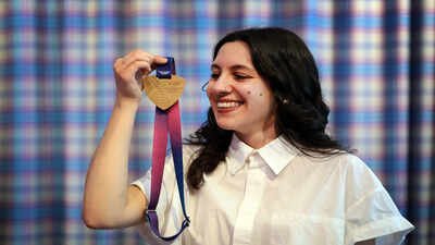 Militsa Milenkova the designer of the official medals for the 2026 Commonwealth Games poses with a medal (Getty Images) Historic first at Commonwealth Games as Braille medals debut in Glasgow
