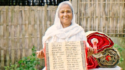 Padma Shri Hemoprova Chutia. (Image Courtesy: History TV18) Meet Hemoprova Chutia: The Padma Shri awardee who cannot read Sanskrit but embroidered the entire Bhagwad Gita on a 280-foot cloth