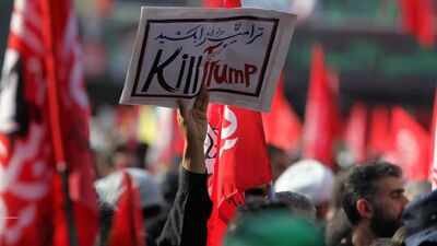 Posters by mourners during Khamenei's funeral call for the killing of Trump and Netanyahu 'Kill them both like dogs': Khamenei funeral mourners offer land for Trump and Netanyahu's heads