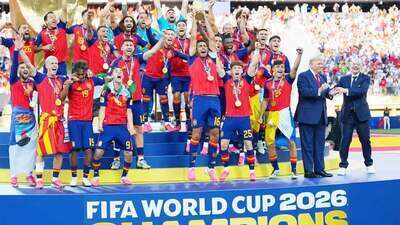 PTI Photo Awkward scenes! Donald Trump remains on podium during Spain's FIFA World Cup trophy celebrations; Gianni Infantino steps in - WATCH