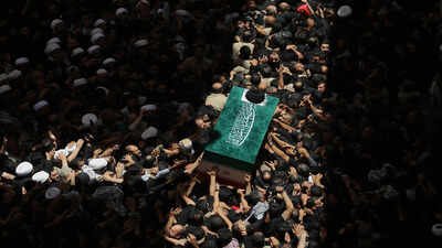 The coffin of the late Iranian Supreme Leader Ayatollah Ali Khamenei is carried by mourners to the Imam Ali Shrine in Najaf, Iraq, Wednesday, July 8, 2026. (AP Photo/Anmar Khalil) Iran's Khamenei buried in Mashhad four months after US-Israeli strikes killed him