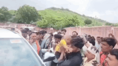 The villagers placed a child atop the MLA’s vehicle to draw attention to their pleas concerning water and electricity shortages 'Go to your MLA': BJP legislator's response to water crisis sparks protest; angry villager places child on car bonnet