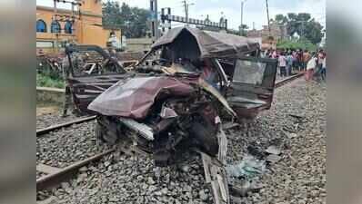 Mangled remains of the pool car that met with the accident Four schoolkids die as train rams pool car at open level crossing, gateman arrested