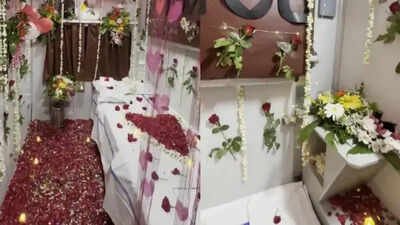 Visuals from viral video that show first AC cabin of Nandigram express transformed into a 'honeymoon suite' for a couple First AC coupe of Mumbai CSMT-Balharshah-Nandigram Express turns into ‘honeymoon suite’; TTE suspended