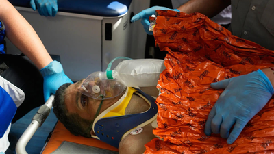 Rescue workers attend to Hernán Alberto Gil Flores after he was pulled from the rubble eight days after he was trapped by twin earthquakes that struck Catia La Mar, Venezuela (AP photo) 'Don't tell my wife': How a Venezuelan man trapped under rubble for over a week was rescued alive