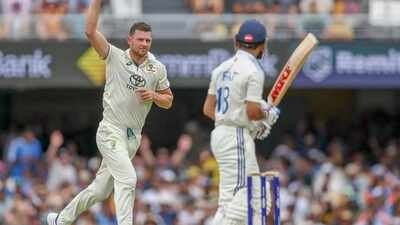 Australia's Josh Hazlewood, left, celebrates the wicket of Virat Kohli, right, during play on day three of the third cricket test between India and Australia at the Gabba in Brisbane, Australia. (File photo/PTI) 'Few boxes to tick': Josh Hazlewood eyes BGT win in India, Ashes in England before retirement