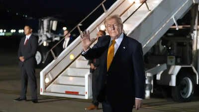 US President Donald Trump waves as he switches planes at US Air Force Base in England, on his way back to Washington from the Nato summit in Turkey Missile threat made Donald Trump move to smaller US jet during Turkey visit: Report