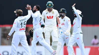 Pat Cummins, center, of Australia walks from the field after being dismissed by Mehidy Hasan Miraz((AP/PTI) Bangladesh stun Australia with historic win, register first-ever Test victory on Australian soil