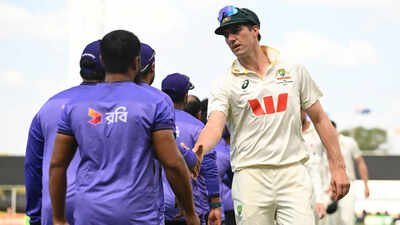 Australian captain Pat Cummins, right, congratulates members of the Bangladesh team (AP) ‘Outplayed us in all facets’: Pat Cummins blunt admission after Australia’s shock defeat