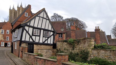 Lincoln's 'Wonky House' set for redevelopment after funding secured In 1933, Lincoln's Crooked House was marked for demolition; work revealed a hidden timber-framed building behind its brick façade and saved it; today it is one of the Cathedral Quarter's most photographed buildings