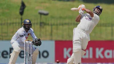 Rishabh Pant plays a shot as Sri Lanka's Niroshan Dickwella watches during day two of the second Test. (AP Photo) Rishabh Pant surpasses MS Dhoni, becomes first India wicketkeeper to score 2,500 away Test runs