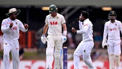 Mehidy Hasan Miraz (2nd R) celebrates with Najmul Hossain Shanto (L) after dismissing Australia's Pat Cummins (2nd L) on the fourth day of the first cricket Test match between Australia and Bangladesh (AFP) Mehidy Hasan Miraz (2nd R) celebrates with Najmul Hossain Shanto (L) after dismissing Australia's Pat Cummins (2nd L) on the fourth day of the first cricket Test match between Australia and Bangladesh (AFP)