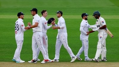England's Harry Brook and Joe Root celebrate after the match (Action Images via Reuters)