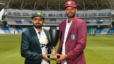 Roston Chase and Babar Azam posing with the trophy. (AFP)