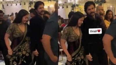 Rashmika Mandanna and Vijay Deverakonda twinned in black and held hands.
