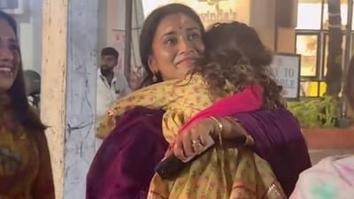 Shriya Saran's daughter Radha clung to her as she got photographed. Shriya Saran's daughter Radha clung to her as she got photographed.
