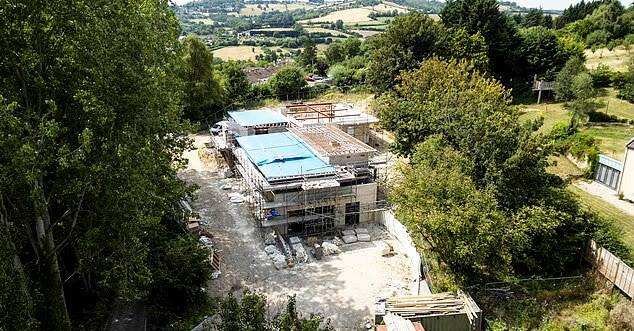A millionaire developer says construction changes were necessary because of difficult ground conditions, as residents demand action over the £3 million property.