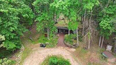Built into nature: The underground home was designed to blend seamlessly into the Missouri Ozarks hillside. A Missouri engineer bought remote Ozarks land in 1970 and slowly built a reinforced-concrete home into the hillside; more than 50 years later, his son is restoring it room by room