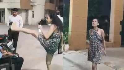 A video shows a woman allegedly abusing security guards at a Greater Noida housing society 'I'll make you clean my shoes': Greater Noida woman abuses guards after delivery boy stopped at society gate