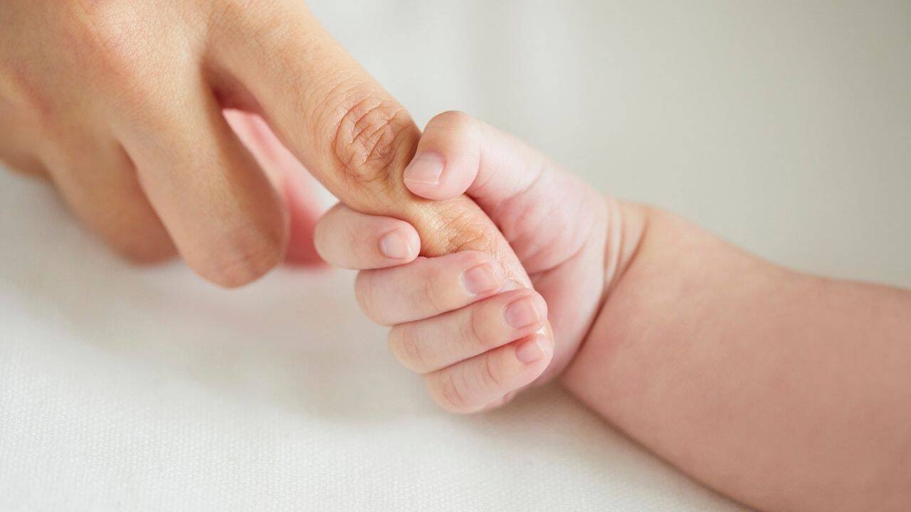 Baby holding hand