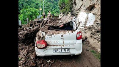 Car lies damaged after falling rocks and debris from a hillside hit it following continuous heavy rainfall in the Anni area of Kullu 70 dead, 204 roads blocked: Himachal Pradesh reels under monsoon fury; damage tops Rs 910 crore