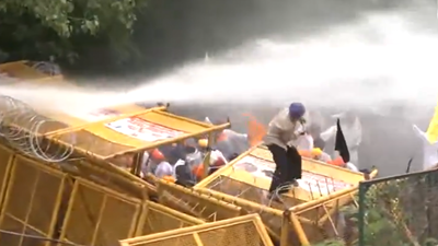 Police use tear gas and water cannons to disperse the protesters belonging to the Quami Insaaf Morcha. Chandigarh police use tear gas, water cannons to stop Qaumi Insaaf morcha march towards gov's house