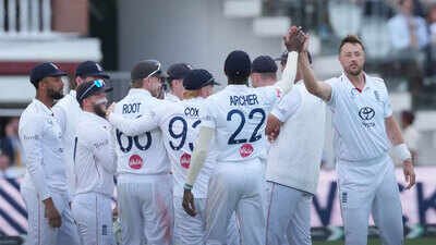 England's Ollie Robinson, right, celebrates with teammates the dismissal of Pakistan's Shan Masood. (AP Photo) ENG vs PAK 2nd Test: England thrash Pakistan by 194 runs at Lord’s to take an unassailable 2-0 series lead