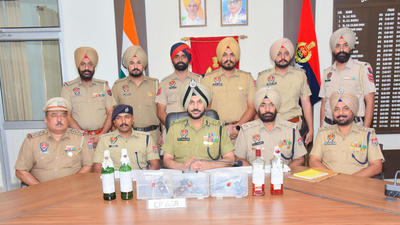 Former Amritsar police commissioner Gurpreet Singh Bhullar (centre). Jantar Mantar 'terror plot' row: Amritsar top cop Gurpreet Bhullar shunted; BJP cries foul