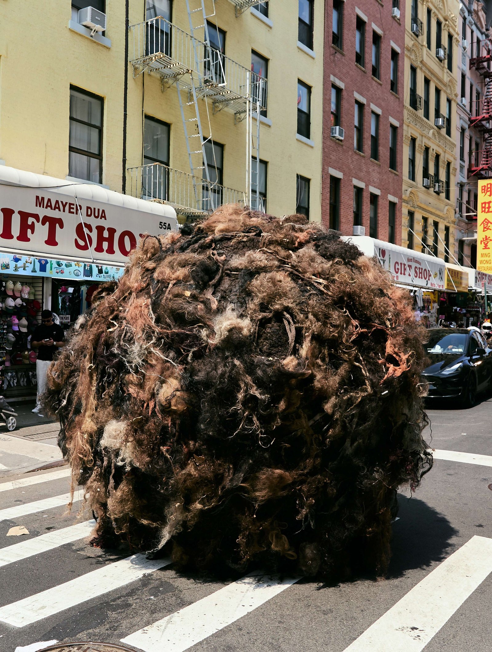 Giant 10-foot ‘Tumblehair’ rolls through NYC streets
