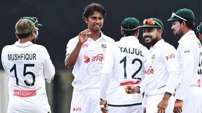 Bangladesh's Hasan Mahmud, second left, celebrates with teammates after taking the wicket of Australia's Travis Head during their test match in Darwin, Australia, Thursday, Aug. 13, 2026. (AP) Hasan Mahmud's career best 6-55 blows Australia away; Bangladesh take control on day 1 of Darwin Test