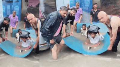 In Valmiki Basti, some residents waded through waist-deep water while others carried schoolchildren across flooded lanes on a large blue plastic sheet being used as a makeshift raft. Watch: Locals use makeshift raft to ferry schoolkids through flooded Delhi streets