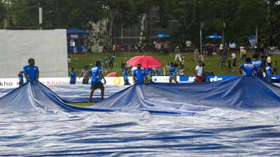 Colombo: Ground staff covers the field amid rain on the fourth day of the second Test cricket match between India and Sri Lanka, in Colombo, Sri Lanka. (PTI Photo/Shailendra Bhojak) 2nd Test: Rain delays India’s impending series victory over Sri Lanka on Day 4