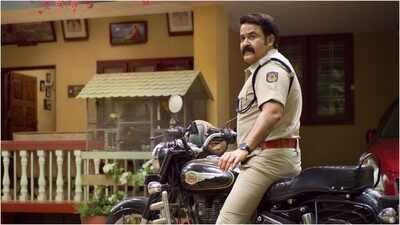 Mohanlal shares Onam poster of 'Athimanoharam'; actor appears as cop TS Lovelajan Mohanlal shares Onam poster of 'Athimanoharam'; actor appears as cop TS Lovelajan; reunites with Meera Jasmine