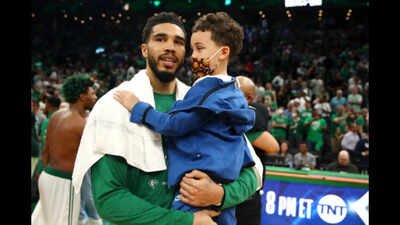 Jayson Tatum #0 of the Boston Celtics celebrates with his son, Jayson “Deuce” Christopher Tatum Jr., after defeating the Milwaukee Bucks 109-81 in Game Seven of the 2022 NBA Playoffs Eastern Conference Semifinals at TD Garden on May 15, 2022 in Boston, Massachusetts. NOTE TO USER: User expressly acknowledges and agrees that, by downloading and/or using this photograph, User is consenting to the terms and conditions of the Getty Images License Agreement. (Photo by Adam Glanzman/Getty Images) “He was always there for me”: How Jayson Tatum’s son became a source of strength through the NBA star’s rise to the top