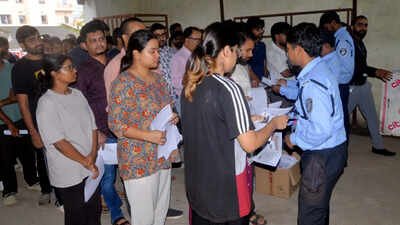 File photo: Students wait outside an examination centre before appearing in the NEET-PG 2026 examination NEET-PG 2026 exam at Jaipur centre rescheduled to September 5 over power outage