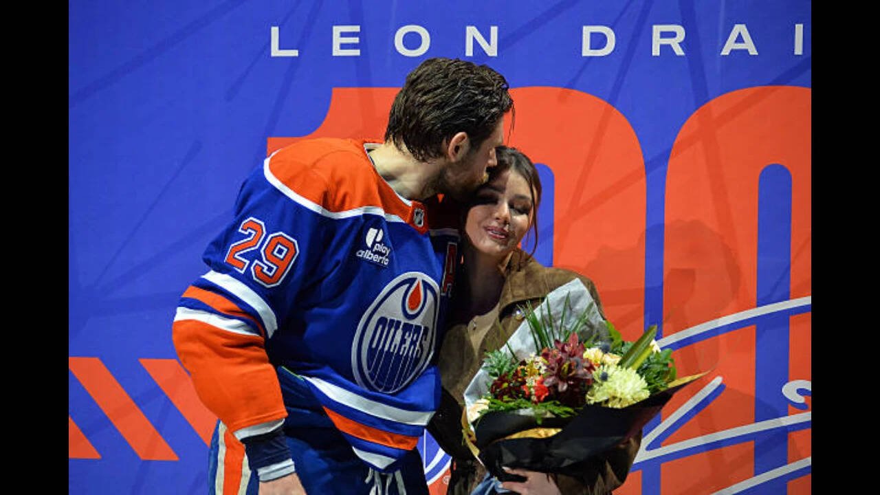 NHL-Leon Draisaitl #29 of the Edmonton Oilers kisses his spouse Celeste Desjardins during Draisaitl's 1000th NHL point ceremony prior to the game against the Los Angeles Kings at Rogers Place on January 10, 2026, in Edmonton, Alberta, Canada