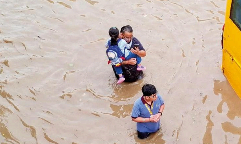 Parents were seen carrying their children amid the flood like situation