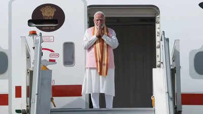 Prime Minister Narendra Modi gestures as he boards the flight for Tashkent, Uzbekistan, in New Delhi PM Modi begins four-day Uzbekistan, Kyrgyzstan visit for SCO summit; what's on agenda