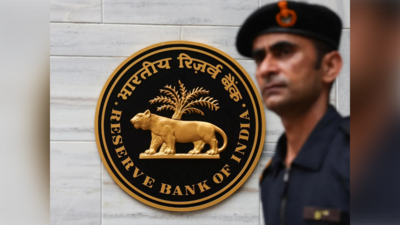 File photo: A man walks past the Reserve Bank of India (RBI) logo outside its headquarters in Mumbai (Picture credit: Reuters) RBI intervenes to support rupee as oil prices, dollar demand rise: Report