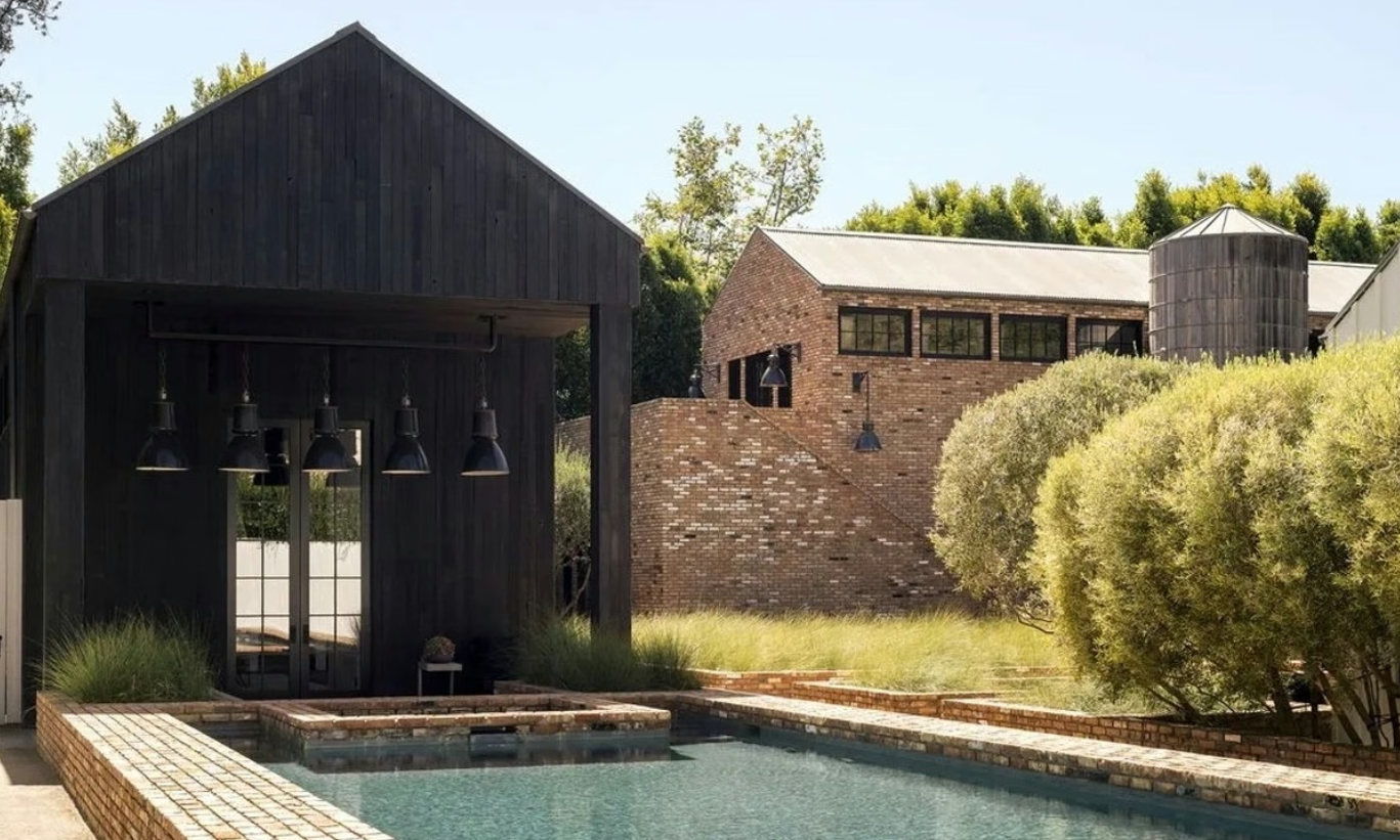 Reclaimed brick and vintage details define the stunning residence.