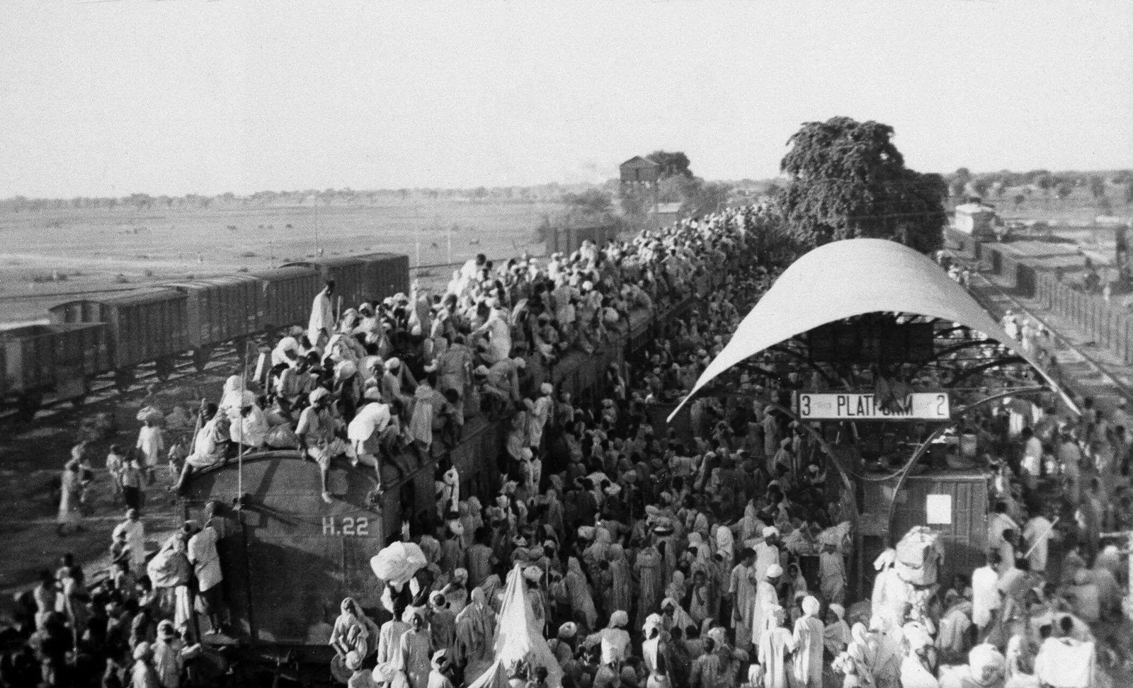Refugees crowd onto a train