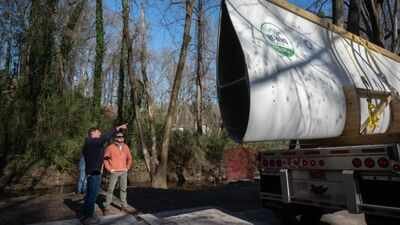 Image Credit: Allison Carter via Georgia Tech Research News Center Atlanta reused a nearly 7,000-pound wind turbine blade as a 50-foot pedestrian bridge; the retired Colorado blade now carries walkers through Beaverbrook Park