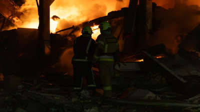 Firefighters work at a compound of a warehouse hit by an overnight missile strike, amid Russia's attack on Ukraine, in Kyiv, Ukraine Russia kills at least 10 in Ukraine as Zelenskyy accuses Moscow of using North Korean missiles